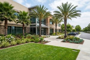 Clean business exterior with a perfectly manicured lawn - commercial mowing services near me