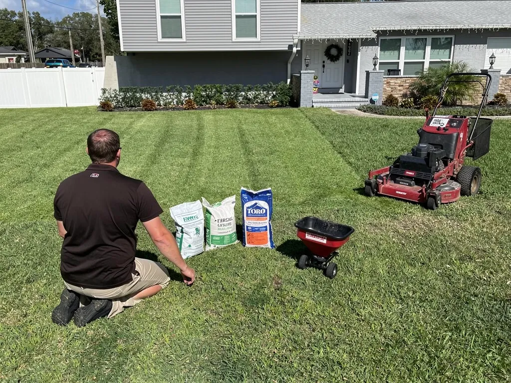 Lutz FL homeowner choosing the right lawn fertilizer with professional guidance